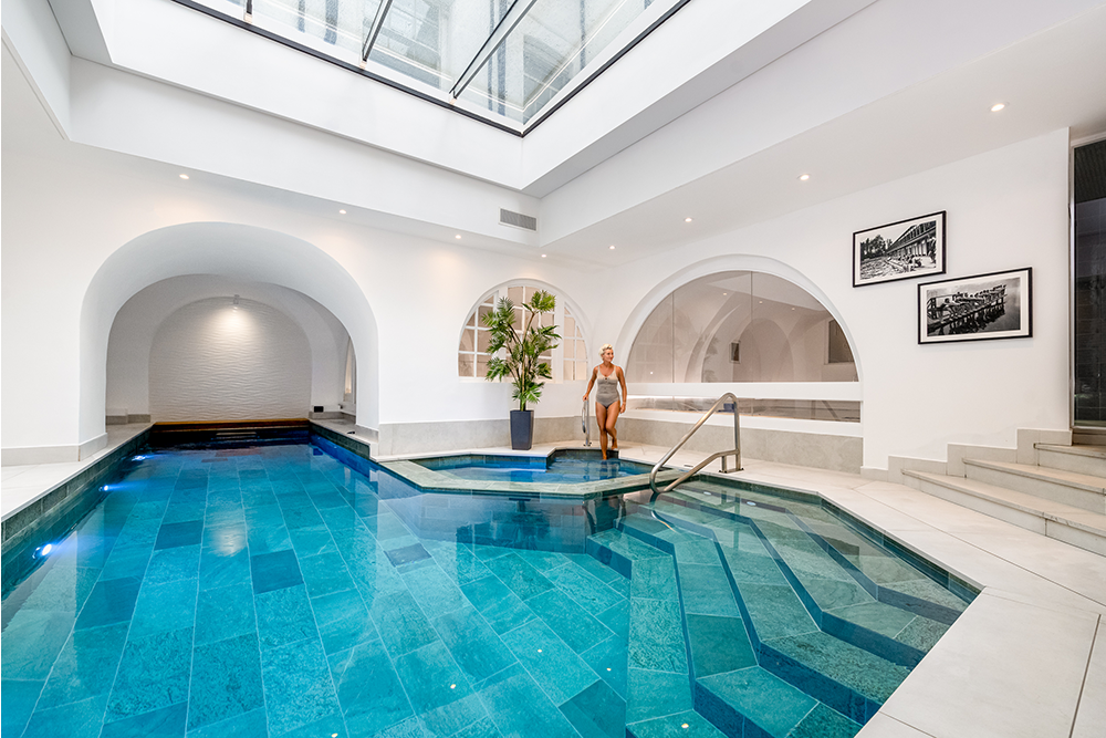 woman steps into spa pool at nordic balance gym