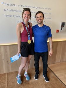 Participant Natasha and therapist Michael after her post-marathon recovery session