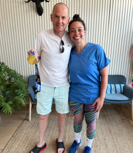Runner Jerry and therapist Nicole after his post-marathon recovery session