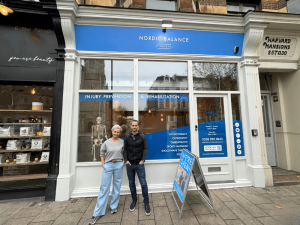 jo and pierre meyer stand outside nordic balance physiotherapy clinic in battersea