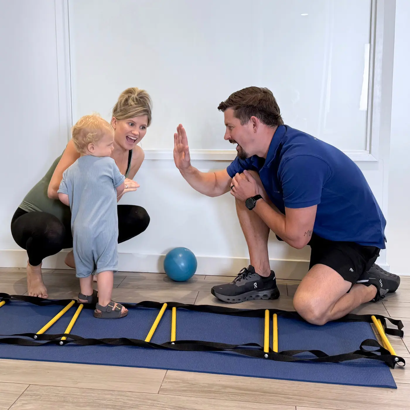 Therapist at Nordic Balance assessing a baby’s balance and movement during a developmental assessment.